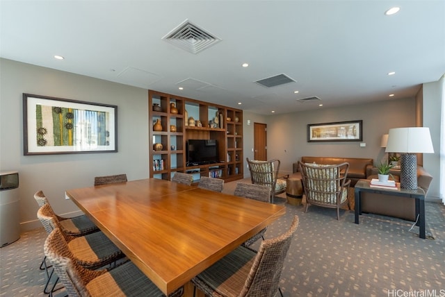 view of carpeted dining area