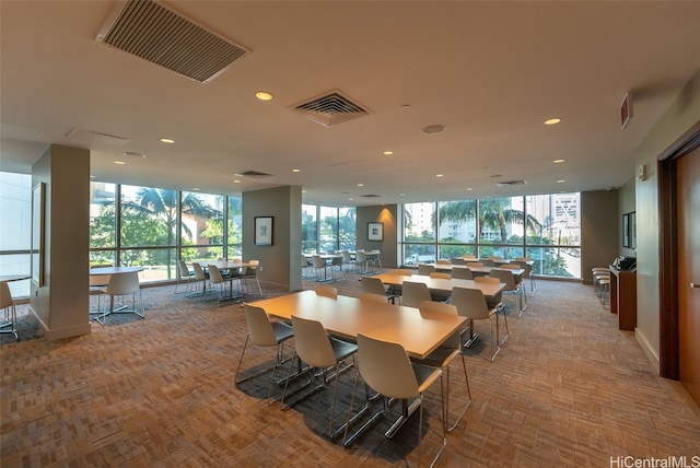 dining space featuring light parquet floors