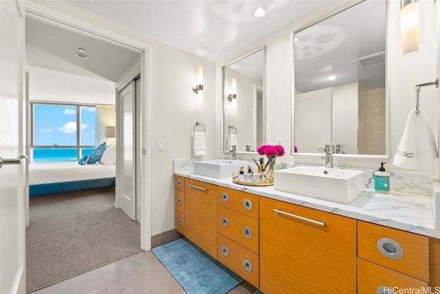 bathroom with tile patterned floors and vanity