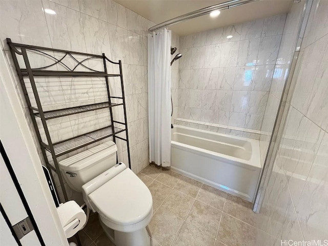 full bath with toilet, shower / tub combo, tile walls, and tile patterned floors