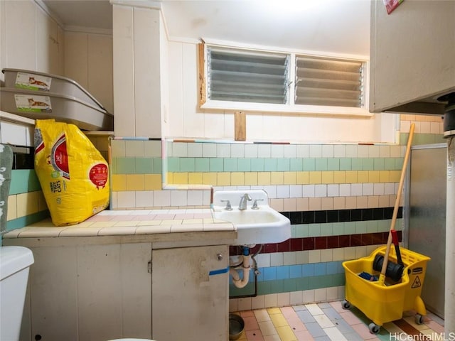 interior space featuring sink and toilet