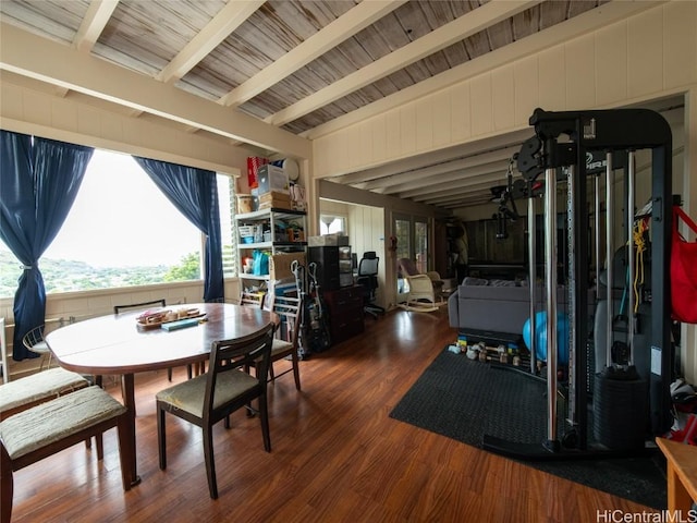 dining room with vaulted ceiling with beams, dark hardwood / wood-style floors, and wooden ceiling