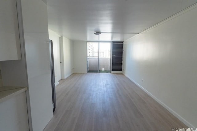 unfurnished room with light hardwood / wood-style floors