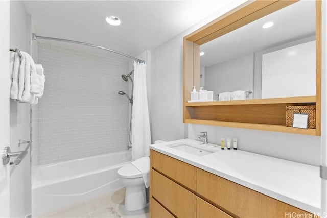 full bathroom with vanity, shower / tub combo, and toilet