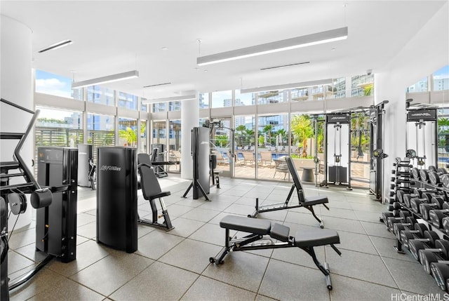 gym with a wall of windows