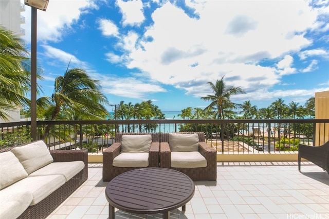 view of patio / terrace featuring a balcony and a water view