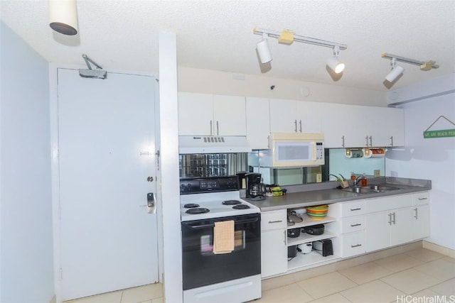 kitchen featuring white cabinets, a textured ceiling, white appliances, and sink