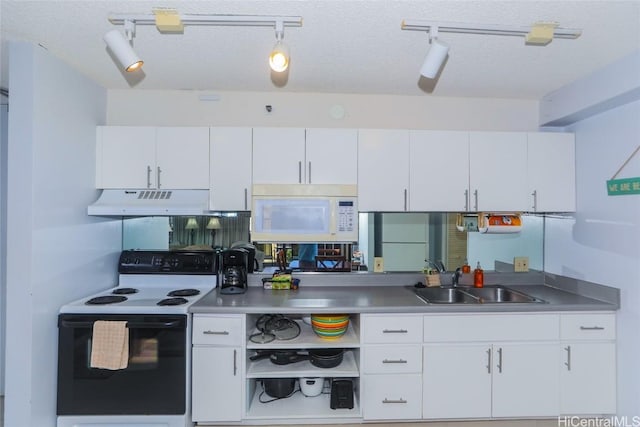 kitchen featuring stainless steel counters, sink, a textured ceiling, white appliances, and white cabinets