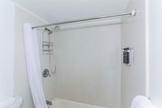 bathroom featuring toilet and shower / tub combo with curtain