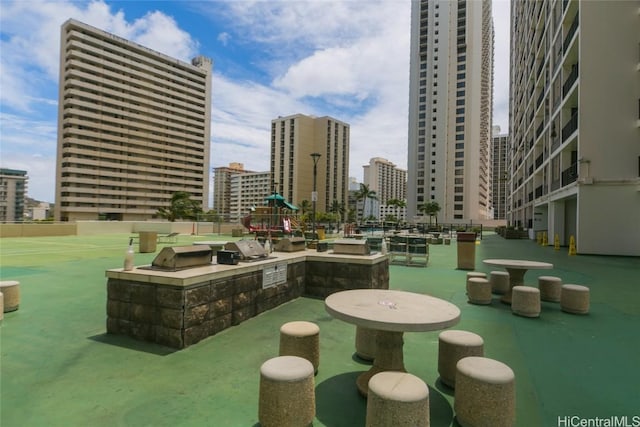 view of home's community with an outdoor kitchen