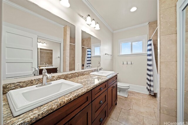 bathroom featuring a shower with curtain, vanity, toilet, and ornamental molding