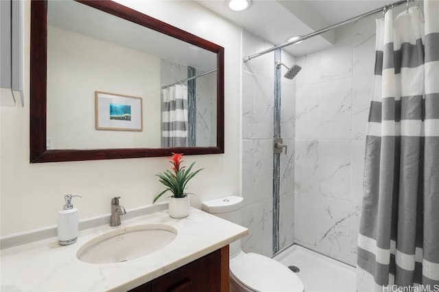 bathroom featuring vanity, toilet, and walk in shower