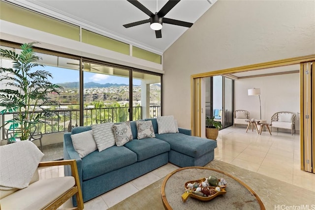 living room featuring tile patterned flooring, high vaulted ceiling, and a ceiling fan