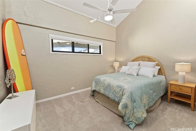 carpeted bedroom with ceiling fan and lofted ceiling