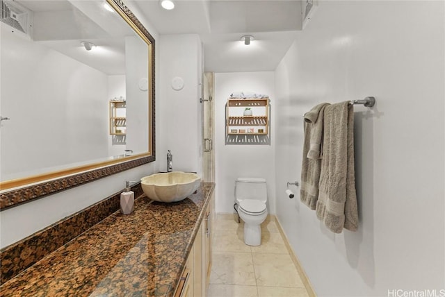 bathroom featuring baseboards, visible vents, toilet, tile patterned floors, and vanity