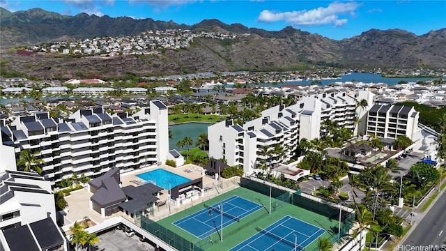 drone / aerial view featuring a water and mountain view