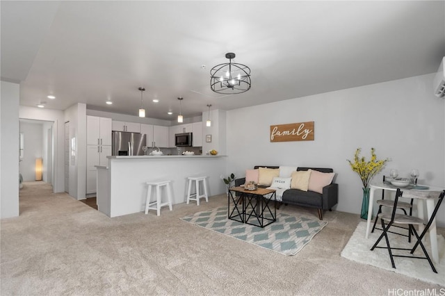 living room featuring light carpet, a notable chandelier, and a wall unit AC