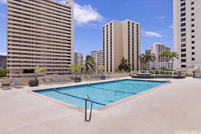 view of swimming pool featuring a patio area