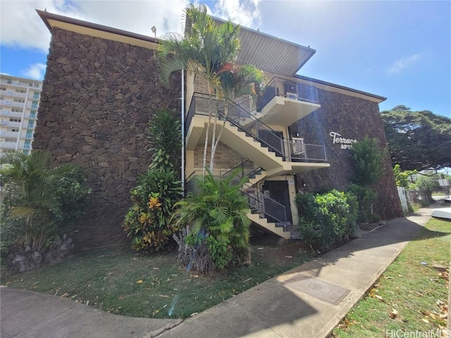 view of property exterior with stairway