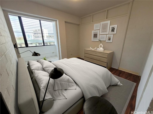 bedroom with wood finished floors