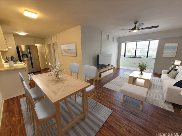 dining room featuring dark hardwood / wood-style floors and ceiling fan