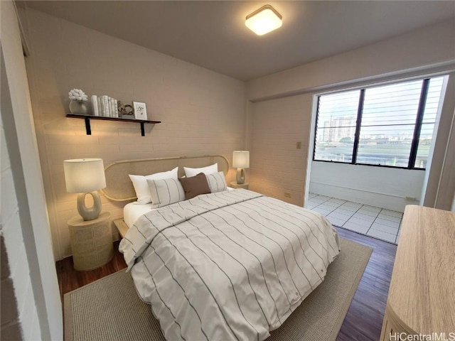 bedroom with dark wood-type flooring