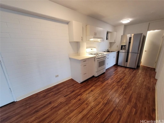 kitchen with white gas range, sink, dark wood-type flooring, stainless steel fridge with ice dispenser, and white cabinets