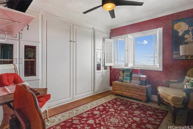 sitting room with hardwood / wood-style floors, ceiling fan, and french doors