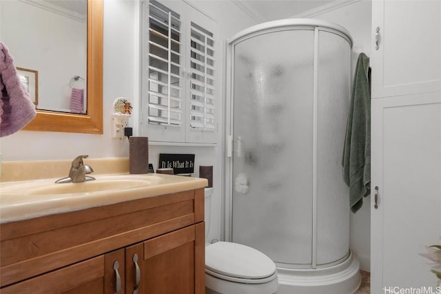 bathroom featuring crown molding, vanity, and walk in shower