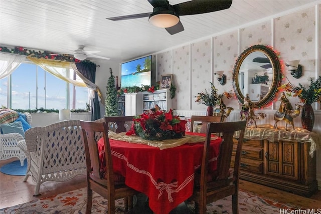 dining area with ceiling fan and ornamental molding