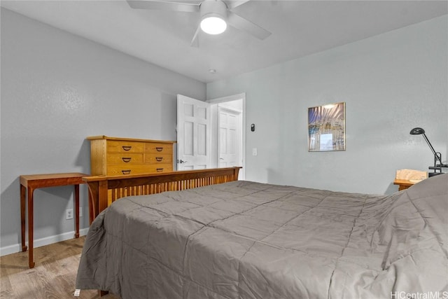 bedroom featuring ceiling fan and light wood-type flooring