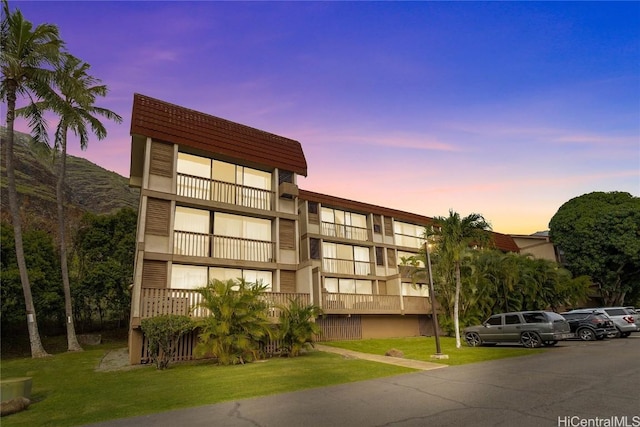 view of outdoor building at dusk