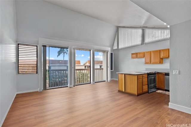 kitchen featuring dishwasher, high vaulted ceiling, light hardwood / wood-style flooring, and range with electric stovetop