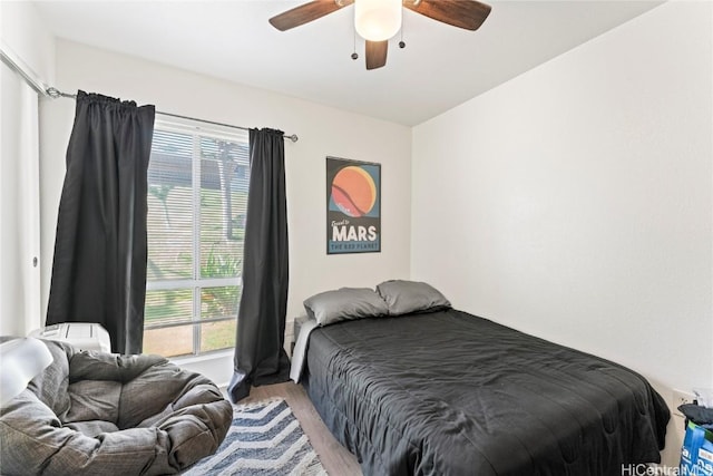 bedroom featuring ceiling fan and light wood-type flooring