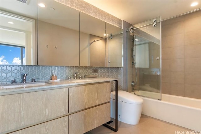 full bathroom featuring vanity, toilet, enclosed tub / shower combo, and backsplash