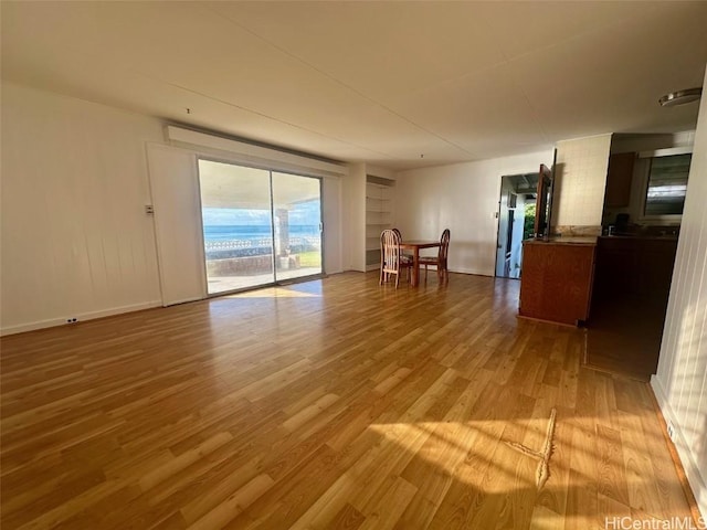 unfurnished living room featuring light wood-type flooring