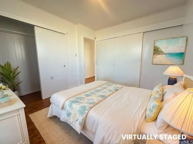 bedroom with dark wood-type flooring and a closet