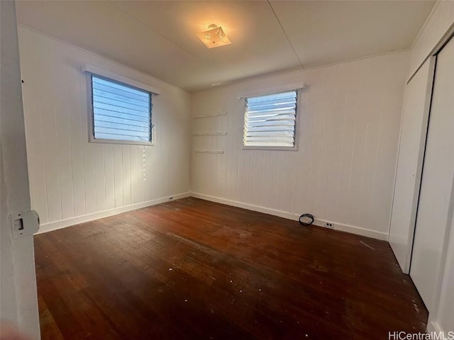 unfurnished room featuring dark hardwood / wood-style floors