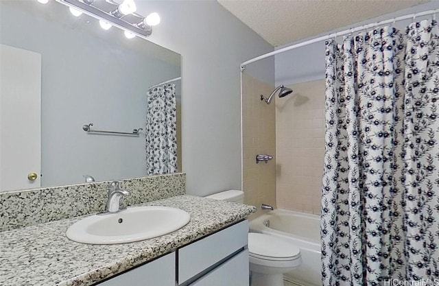 full bathroom featuring shower / tub combo, vanity, a textured ceiling, and toilet