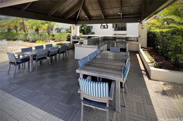 view of patio / terrace featuring a gazebo, a grill, exterior kitchen, and an outdoor wet bar