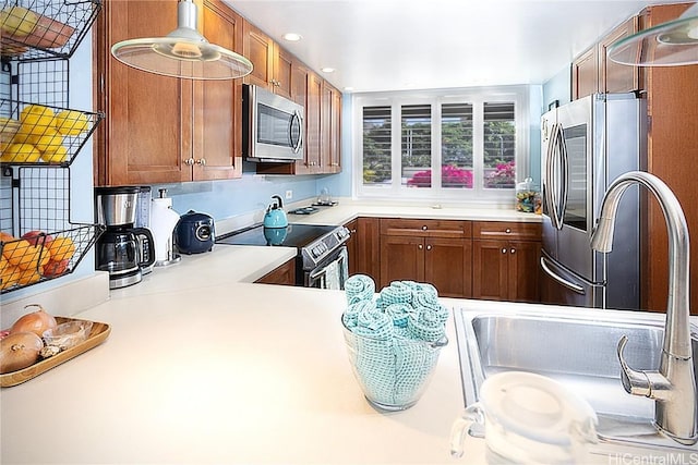 kitchen with sink and appliances with stainless steel finishes