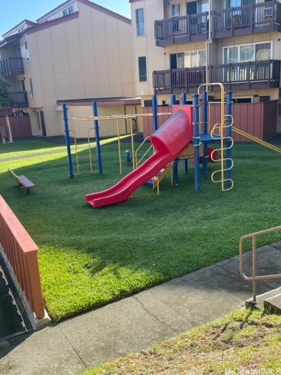 view of play area featuring a lawn