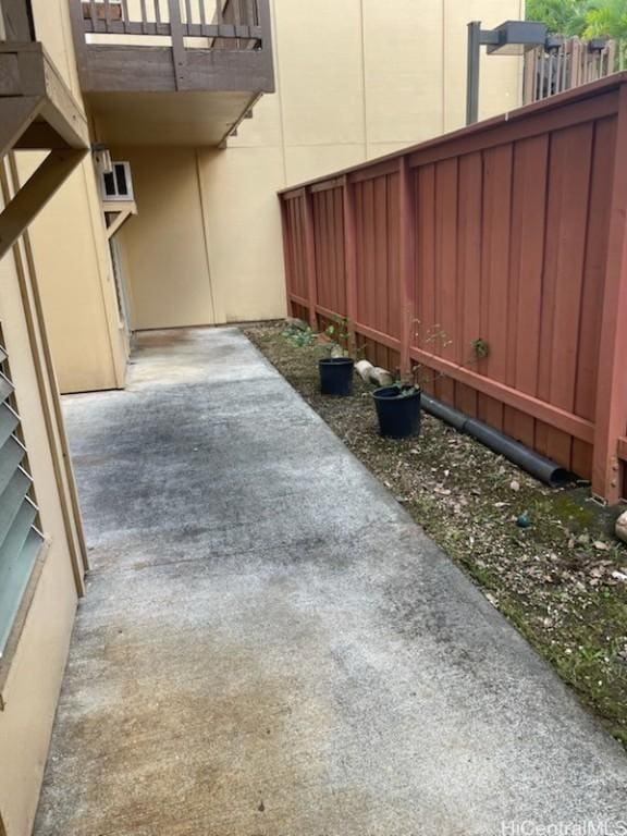 view of yard with a patio area and a balcony