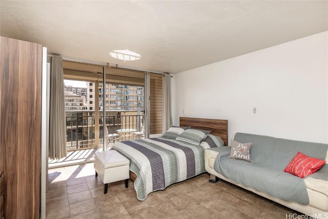 bedroom with access to exterior and expansive windows