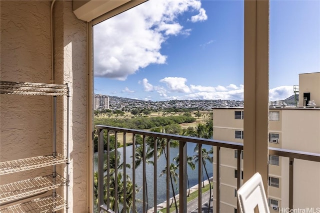 balcony featuring a water view