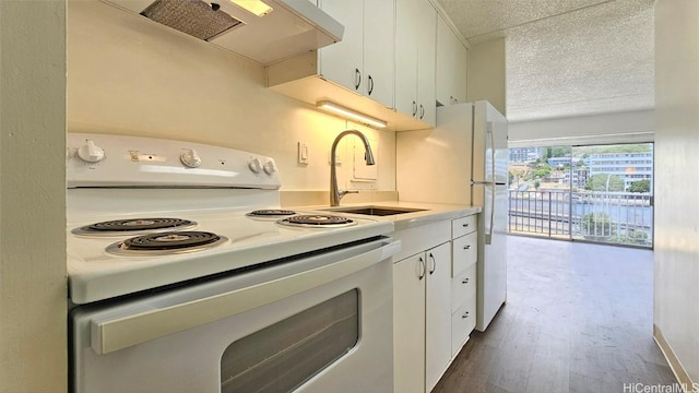 kitchen featuring a textured ceiling, sink, wood-type flooring, white cabinets, and white range with electric cooktop