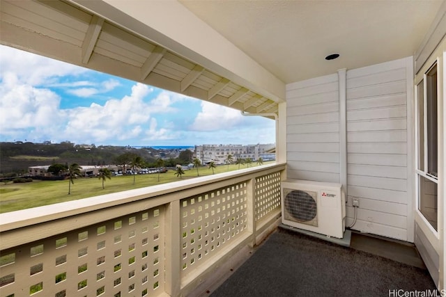 balcony featuring ac unit