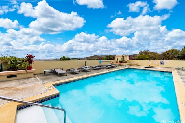 view of swimming pool featuring a patio