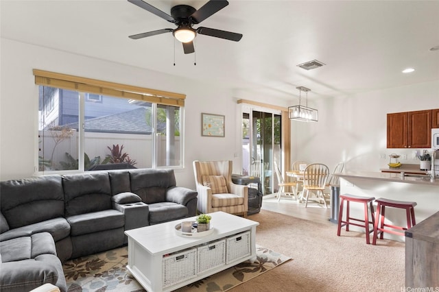 91-6221 Kapolei Pkwy Unit 235, Ewa Beach, HI 96706 - living room with a ceiling fan, carpet floors, and recessed lighting