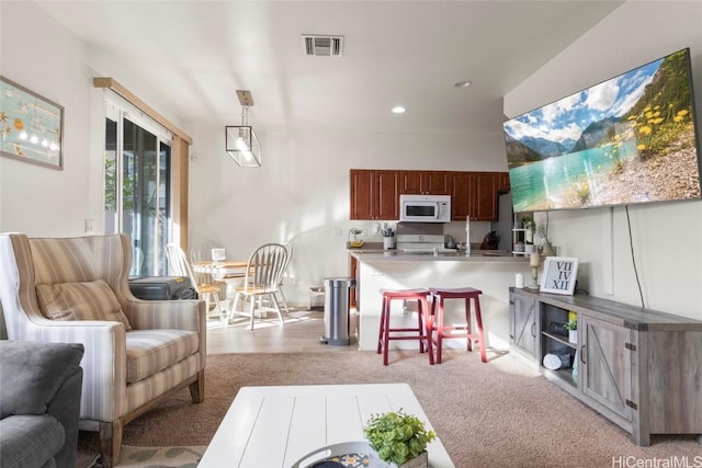 living room featuring light carpet